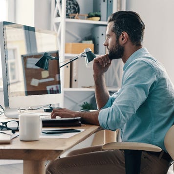man at computer in home office