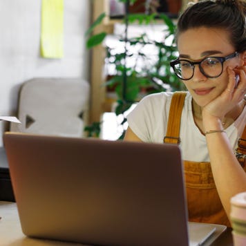 young woman at home using computer