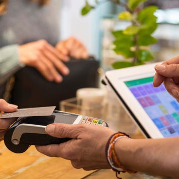 Person holding credit card