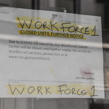 A sign stating that job placement program is closed during coronavirus pandemic.
