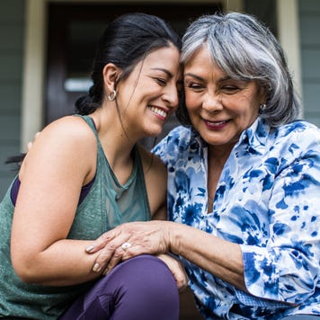 A mother and daughter hold each other