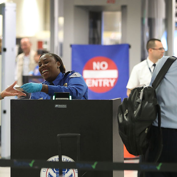 Woman going through airport security