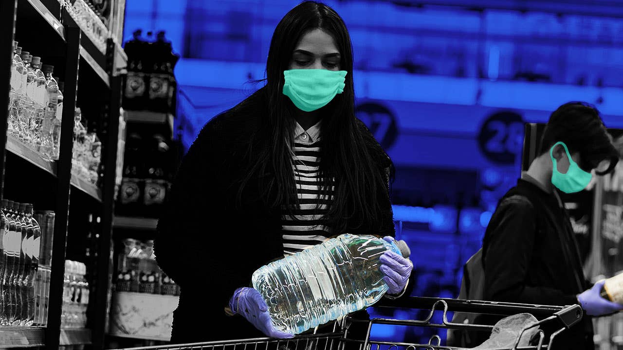 Consumer grabbing water bottle with mask during coronavirus