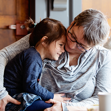 Grandparent with grandchild in cafe