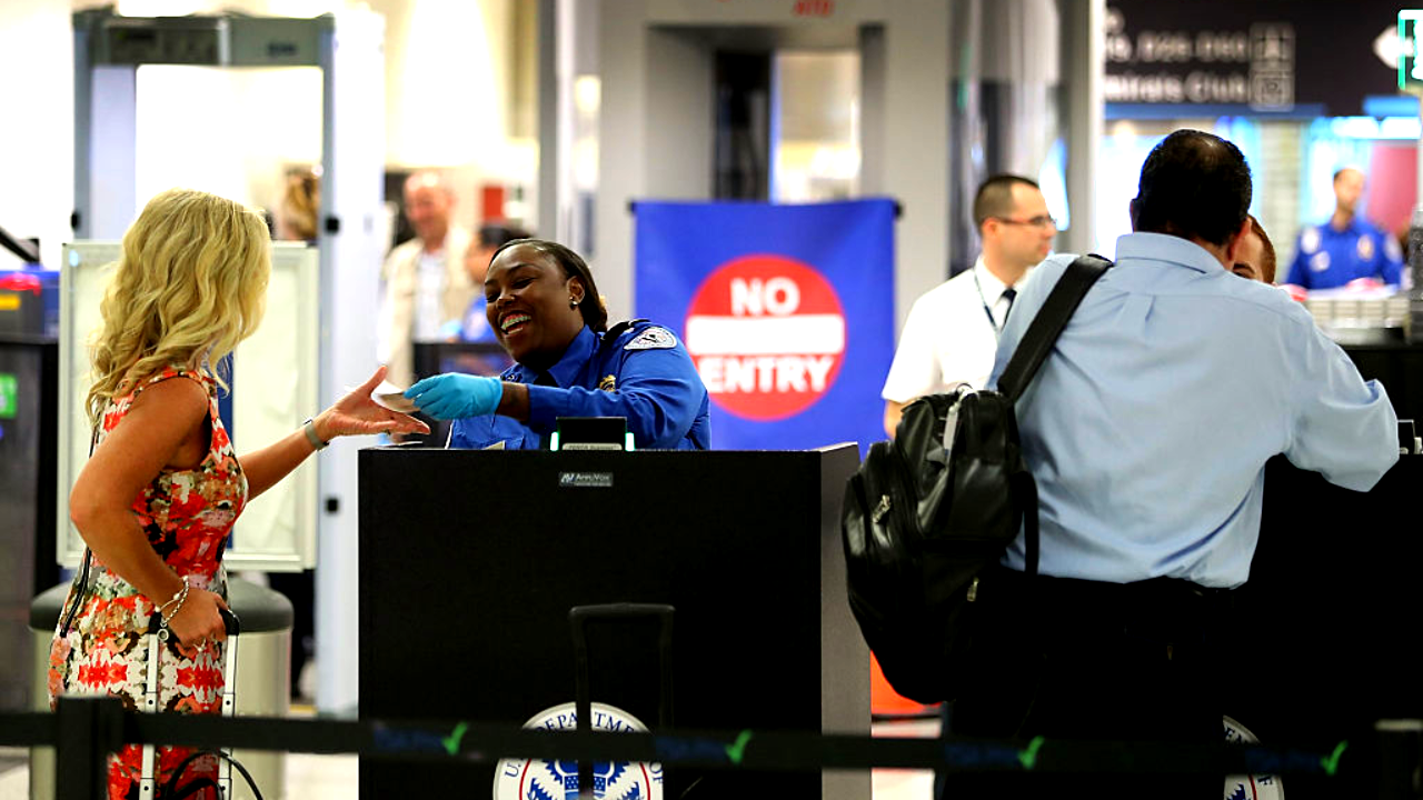 Woman going through airport security