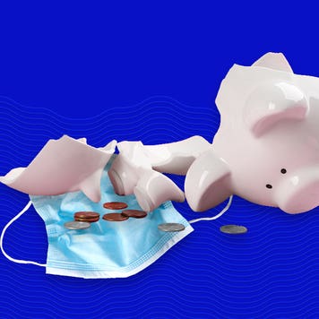 A broken piggy bank, some coins, and a face mask sit on a blue background