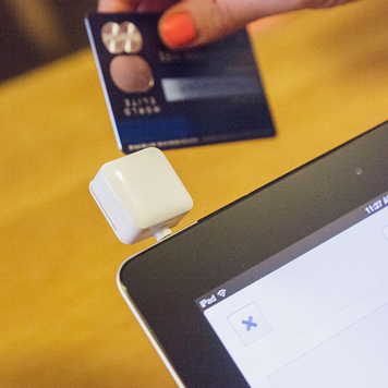 Merchant swiping credit card