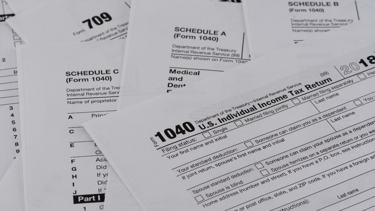 A pile of IRS 1040 tax forms