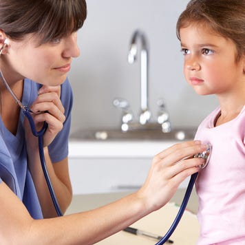 A young girl visits a doctor.