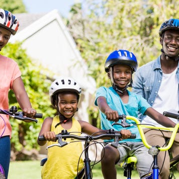 Happy family on bikes