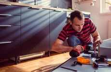 Man works on a kitchen construction project