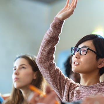 Student asking a question in college class.