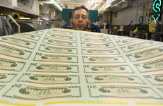 Freshly printed $20 bills are inspected at the Bureau of Engraving and Printing