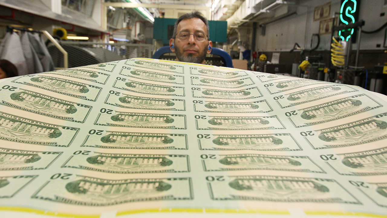 Freshly printed $20 bills are inspected at the Bureau of Engraving and Printing