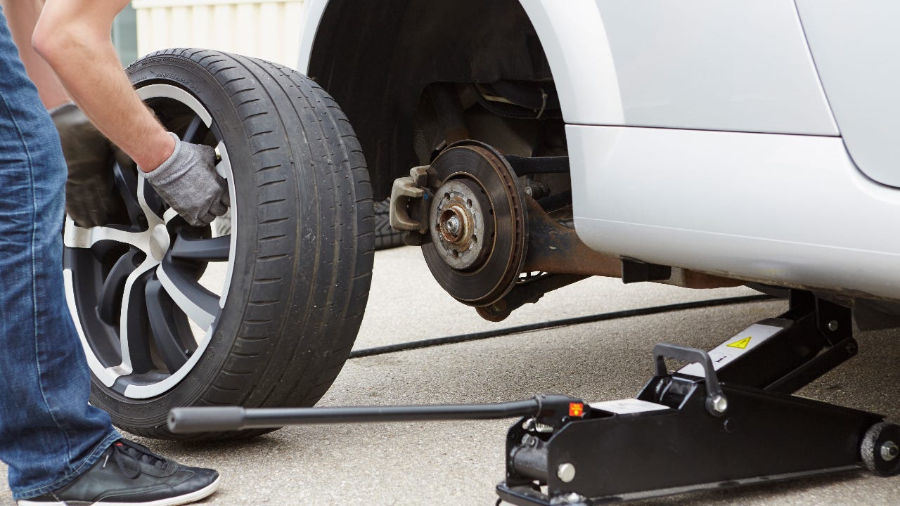 Person working on car