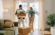 Asian couple moving new house