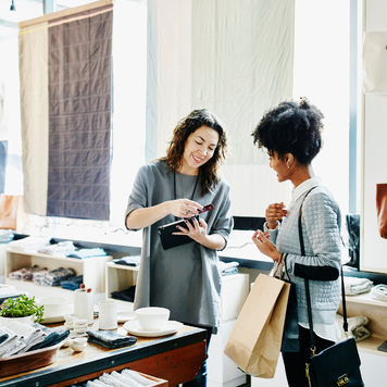 Woman paying for an item in a retail store