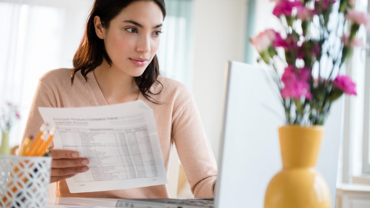 Woman paying bills on laptop