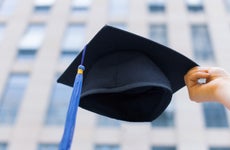 Graduation cap with university building