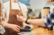 Man using apple watch to pay for coffee