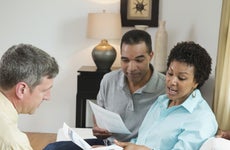 An older couple reviews their finances with an expert.
