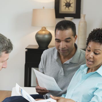 An older couple reviews their finances with an expert.
