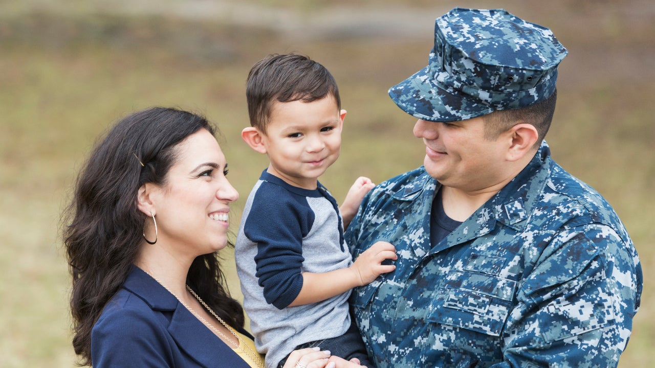 Hispanic military man with little boy and wife