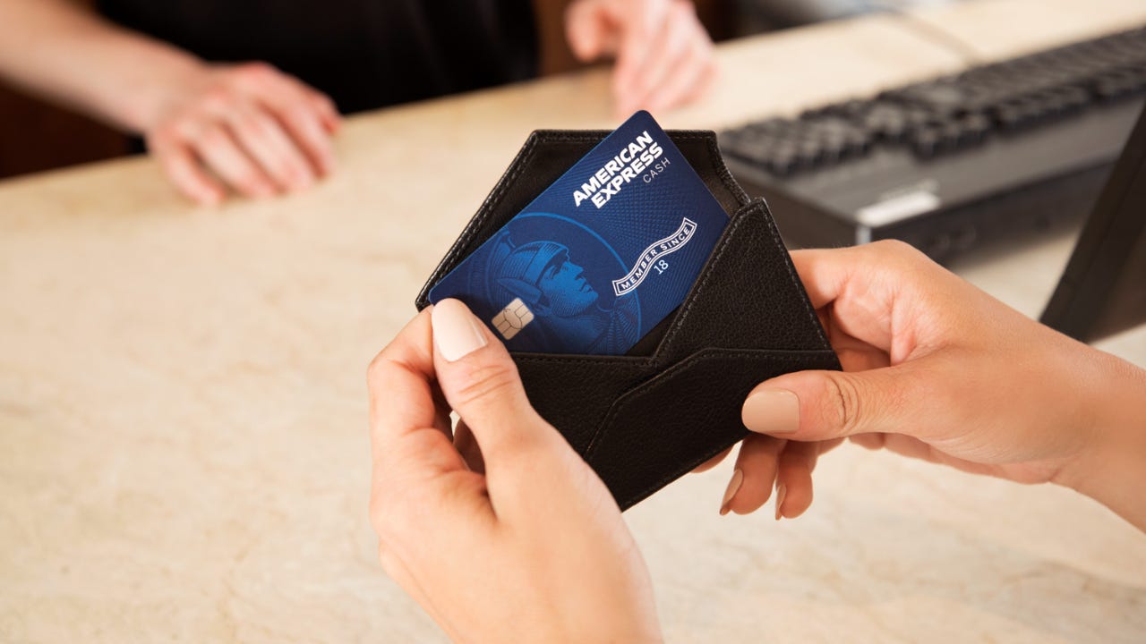 Person holding credit card