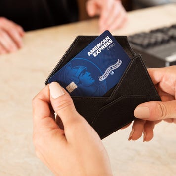 Person holding credit card