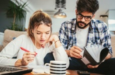 Young couple works on taxes together