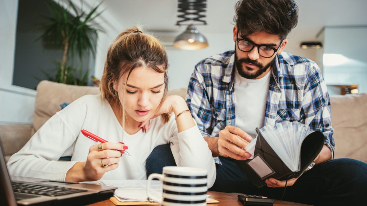 Young couple works on taxes together