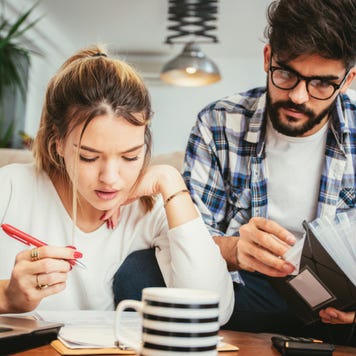 Young couple works on taxes together