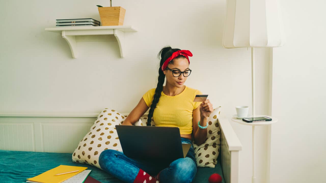 women holding laptop in lap