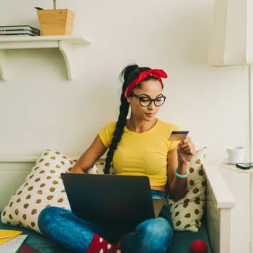 women holding laptop in lap