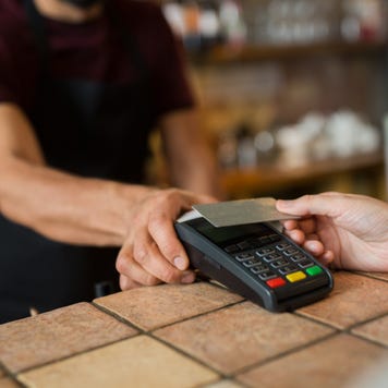 man paying with card