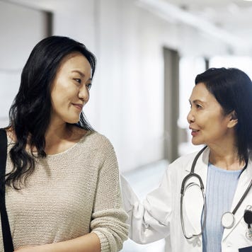 A woman consulting her health specialist.
