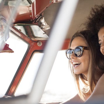 A black woman and her friend are enjoying a nice drive!