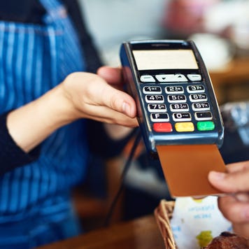 Person inserting credit card