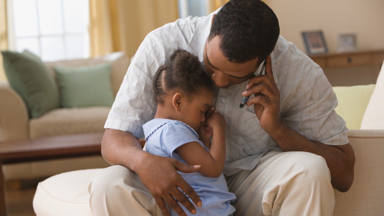 Father hugging daughter