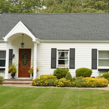 A single-story home with yard and driveway