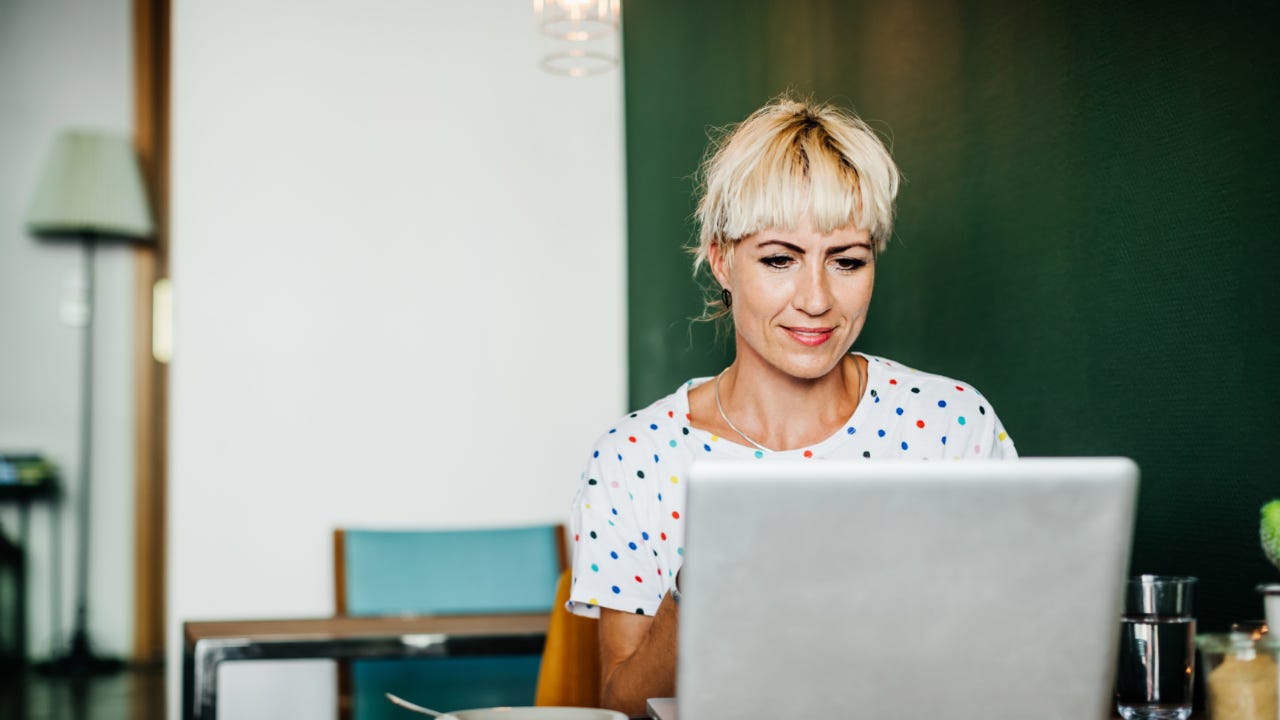 Person at computer in cafe