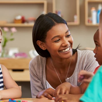 Elementary school teacher working with students