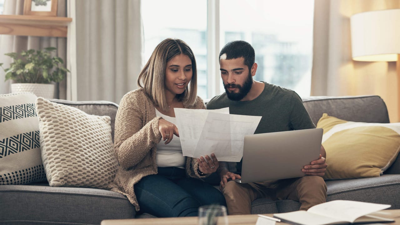 Couple paying their bills at home