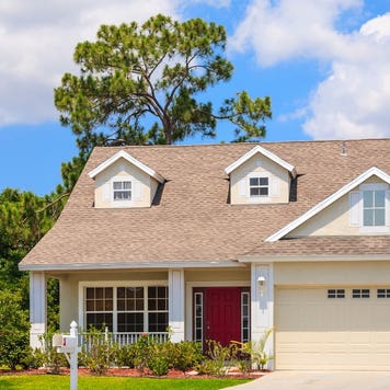 A small cottage-style home with attached garage