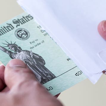 Men hands holding a US Government Treasury check