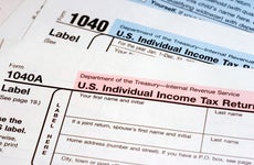A photo of two IRS 1040 forms