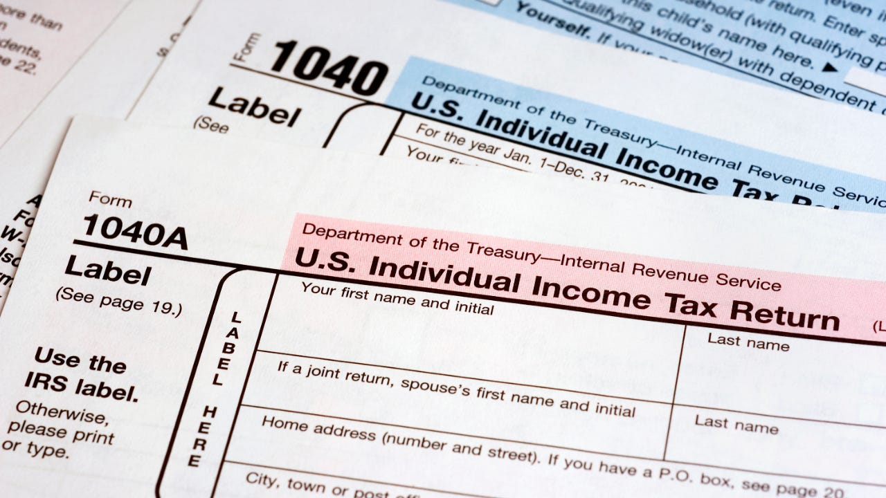 A photo of two IRS 1040 forms