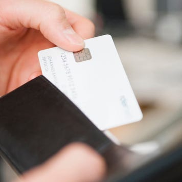 Person looking at credit card