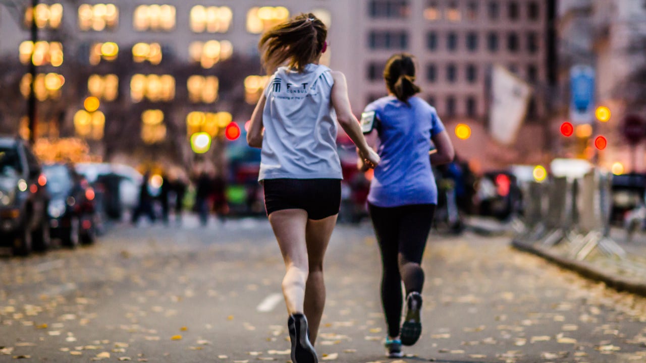Two women running.
