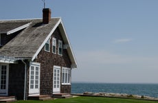 Cedar shingle house on the water in Cape Cod.